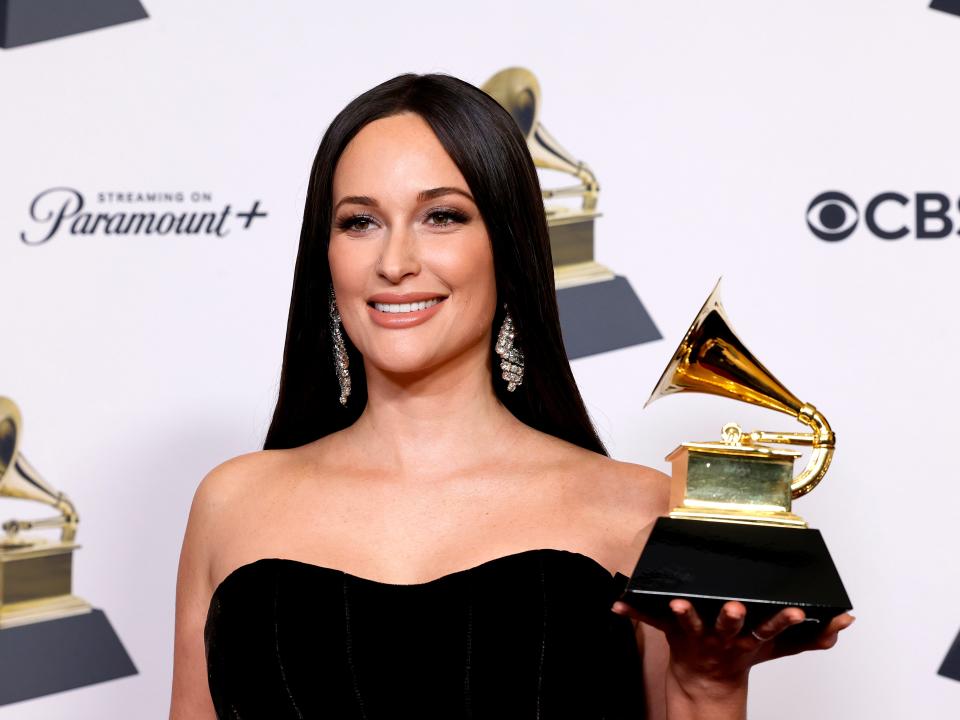 Kacey Musgraves poses with her Grammy Award for "Best Country Duo/Group Performance" in 2024.