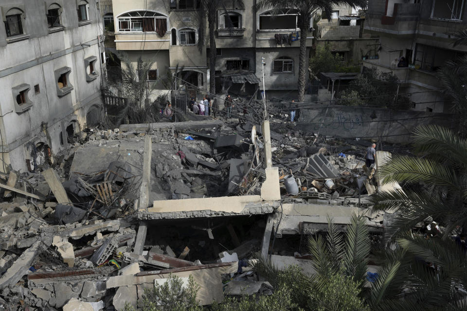 Palestinians inspect the rubble of Islamic Jihad member Anas Al Massri's house after it was hit by an Israeli airstrike last night in Beit Lahiya, northern Gaza Strip, Thursday, May 11, 2023. (AP Photo/Adel Hana)