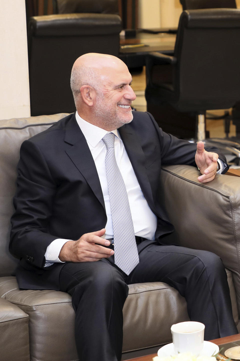 FILE - In this Aug. 8, 2019 file photo, by Lebanon's official government photographer Dalati Nohra, then Lebanese Public Works and Transportation Minister Youssef Fenianos, speaks during a meeting with Prime Minister Saad Hariri, at the government House, in Beirut, Lebanon. On Thursday, Dec. 10, 2020, the Lebanese prosecutor probing this summer's port explosion in Beirut filed charges against caretaker Prime Minister Hassan Diab and former Finance Minister Ali Hassan Khalil, as well as Ghazi Zeiter and Youssef Fenianos, both former ministers of public works. All four were charged with negligence leading to deaths over the Aug. 4 explosion at Beirut port, which killed more than 200 people and injured thousands. (Dalati Nohra/Lebanese Government via AP, File)