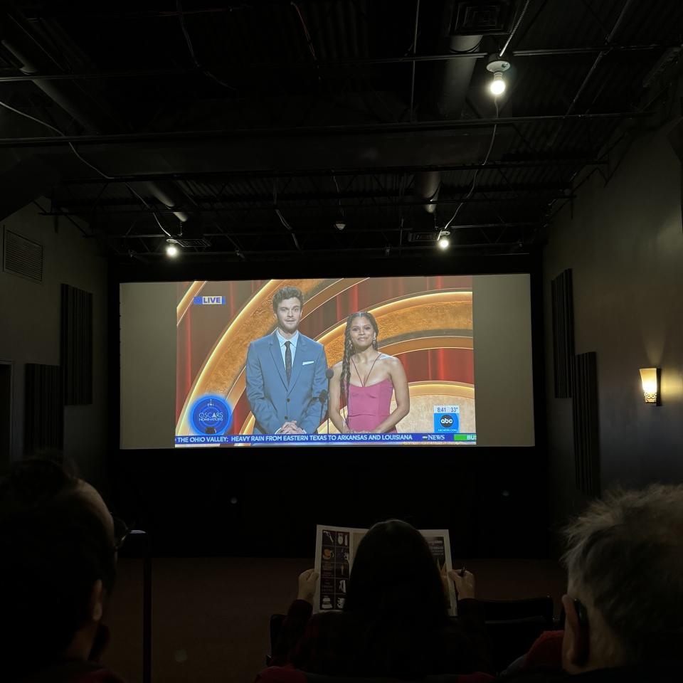 An audience watches Jack Quaid ("The Boys") and Zazie Beetz ("Atlanta") announce this year's Oscar nominations on the big screen at Cinema Capitol.