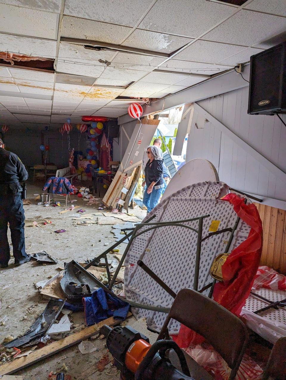 The scene after a vehicle crashed through the Swan Boat Club building during a child's birthday party in Newport on Saturday, April 20, 2024.