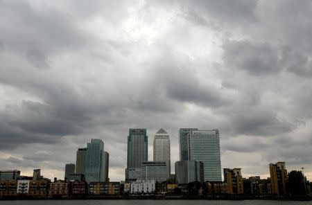 FILE PHOTO: Storm clouds are seen above the Canary Wharf financial district in London, Britain, August 3, 2010. REUTERS/Greg Bos/File Photo