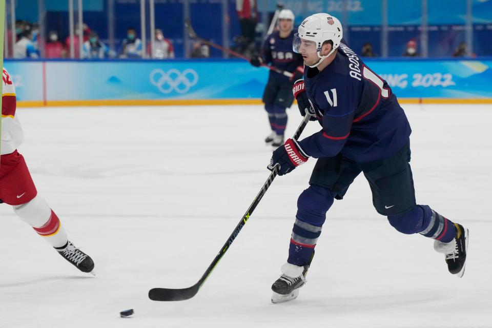 Feb 10, 2022; Beijing, China; Team United States forward Kenny Agostino (11) passes the puck against Team China during the second period during the Beijing 2022 Olympic Winter Games at National Indoor Stadium. Mandatory Credit: George Walker IV-USA TODAY Sports