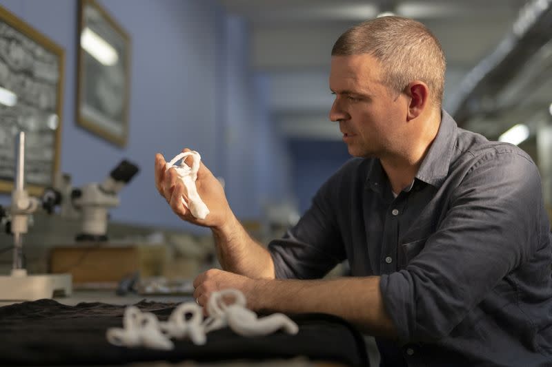 Professor Jonah Choiniere of the University of the Witwatersrand is seen holding a 3D printed model of the lagena