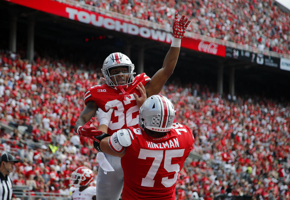 Sept. 9, 2023; Columbus, Ohio; Ohio State Buckeyes running back TreVeyon Henderson (32) celebrates the touchdown with offensive lineman Carson Hinzman (75) during the second half against the Youngstown State Penguins at Ohio Stadium. Joseph Maiorana-USA TODAY Sports