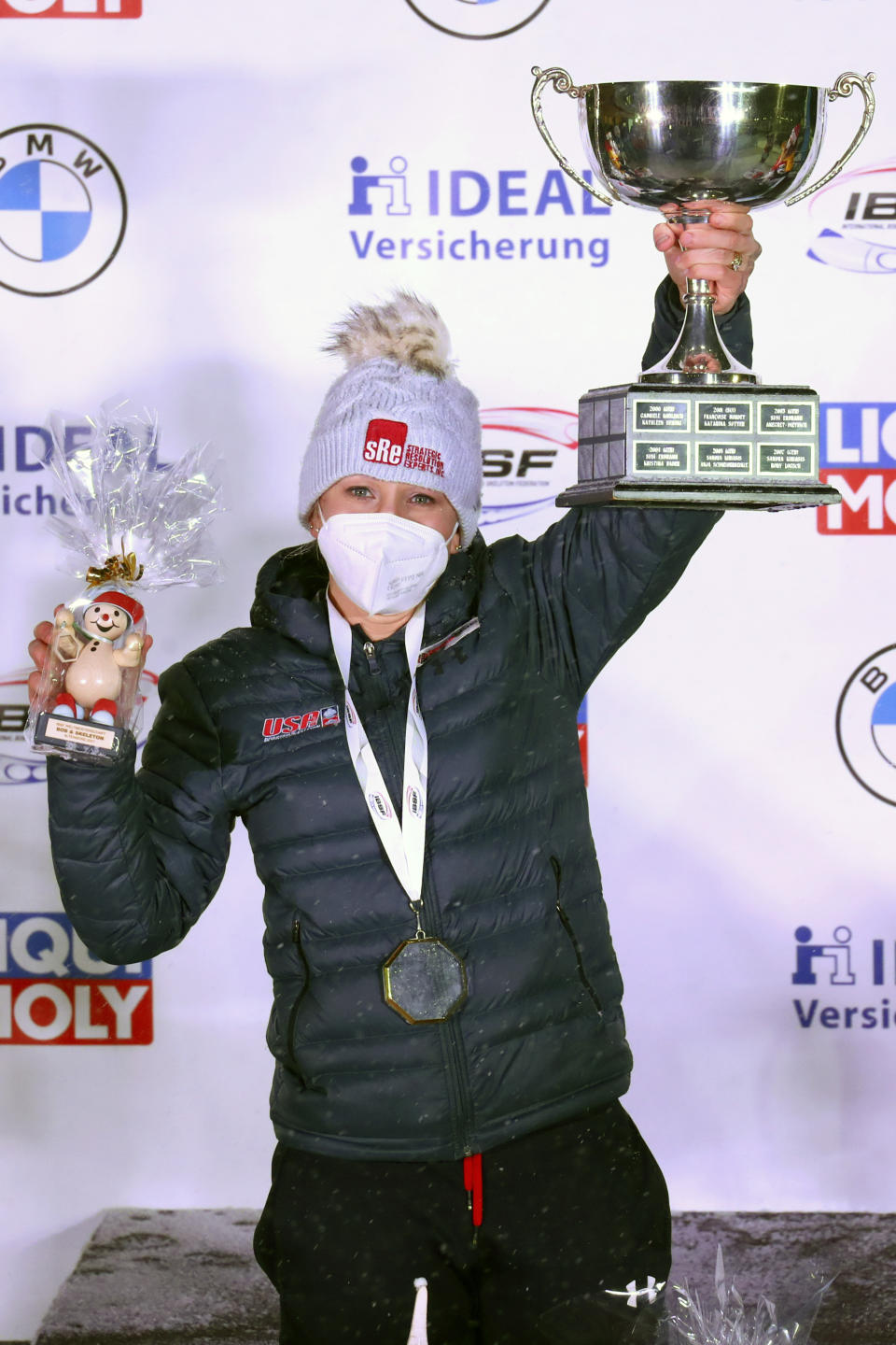 Kaillie Humphries of the United States celebrates after winning with Lolo Jones the two women's bobsleigh race at the Bobsleigh and Skeleton World Championships in Altenberg, Germany, Saturday, Feb. 6, 2021. (AP Photo/Matthias Schrader)