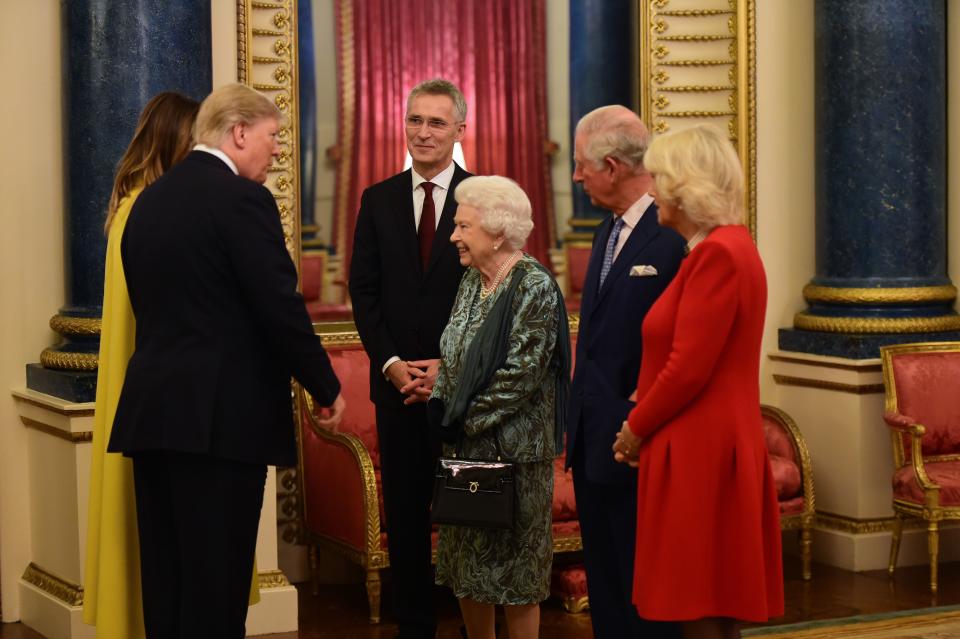 Britain's Queen Elizabeth II (3rd R) speaks with NATO Secretary General Jens Stoltenberg (3rd L), US First Lady Melania Trump (L) and US President Donald Trump (2nd L), Britain's Camilla, Duchess of Cornwall (R) and Britain's Prince Charles, Prince of Wales (2nd R) in Buckingham Palace in central London on December 3, 2019, during a reception hosted by Britain's Queen Elizabeth II ahead of the NATO alliance summit. - NATO leaders gather Tuesday for a summit to mark the alliance's 70th anniversary but with leaders feuding and name-calling over money and strategy, the mood is far from festive. (Photo by Geoff PUGH / POOL / AFP) (Photo by GEOFF PUGH/POOL/AFP via Getty Images)