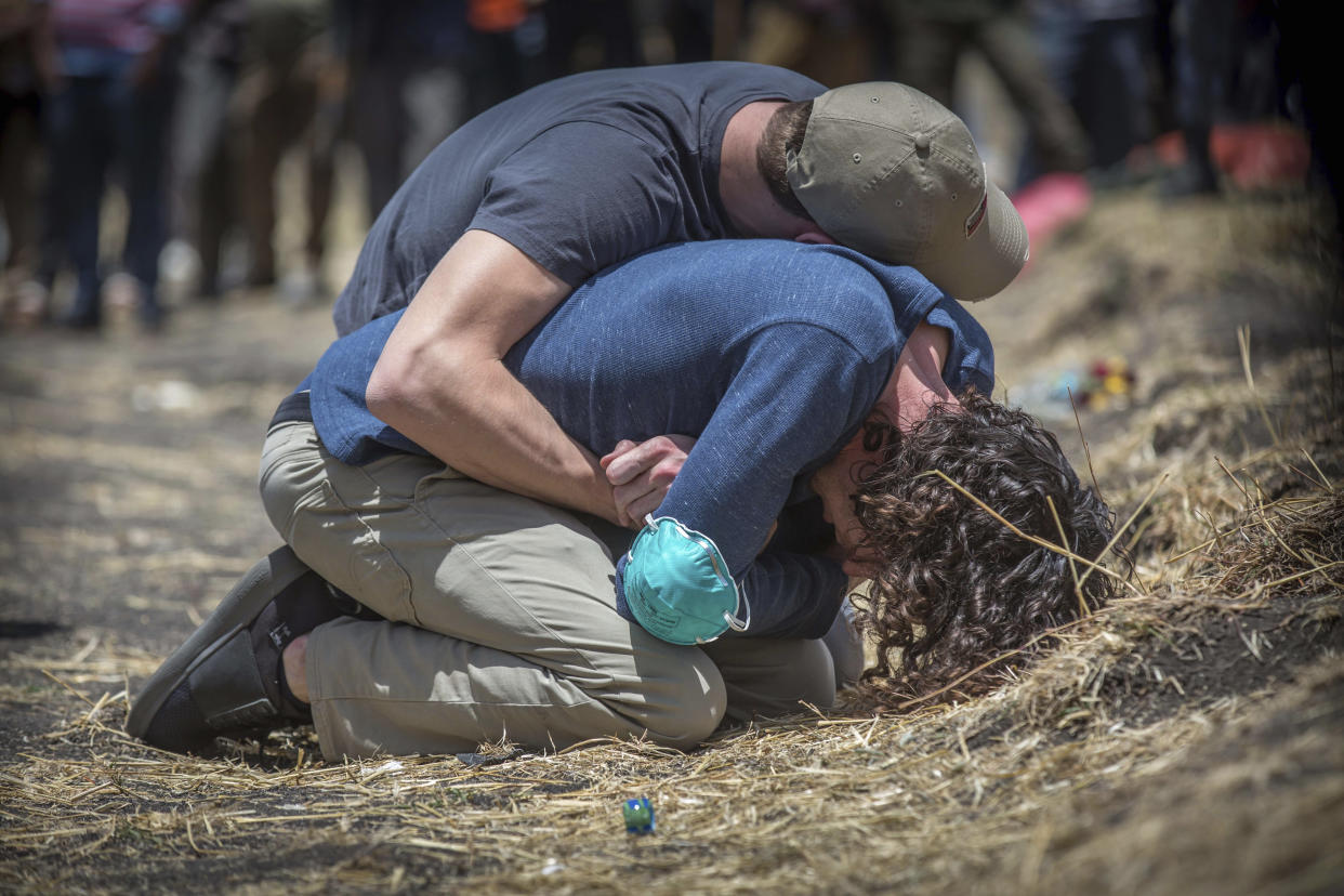 Relatives react at the scene where the Ethiopian Airlines Boeing 737 Max 8 crashed shortly after takeoff on Sunday killing all 157 on board, near Bishoftu, south of Addis Ababa, in Ethiopia, March 13, 2019. (Photo: Mulugeta Ayene/AP)