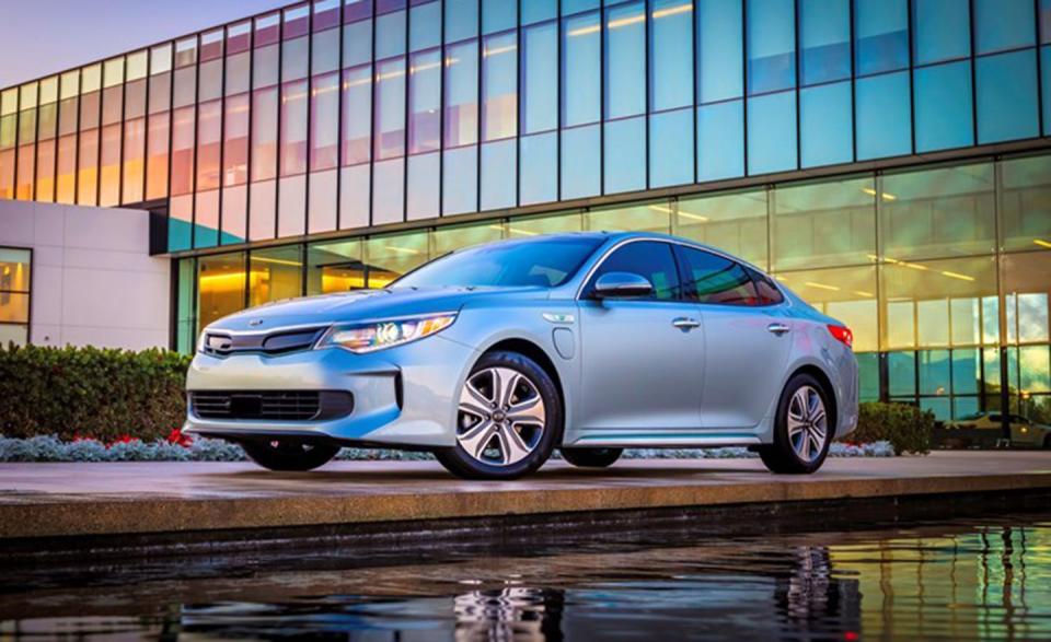 <p>Kia's <a rel="nofollow noopener" href="https://www.caranddriver.com/reviews/2017-kia-optima-plug-in-hybrid-first-drive-review" target="_blank" data-ylk="slk:mid-size Optima plug-in hybrid;elm:context_link;itc:0;sec:content-canvas" class="link ">mid-size Optima plug-in hybrid</a> leverages a 9.8-kWh battery pack for 27 miles of electric-only range and approximately 600-mile total driving range between fill-ups. The Optima plug-in is also very heavy (426 pounds heavier than <a rel="nofollow noopener" href="https://www.caranddriver.com/kia/optima" target="_blank" data-ylk="slk:the regular Optima;elm:context_link;itc:0;sec:content-canvas" class="link ">the regular Optima</a>), so handling suffers, and passing acceleration is woeful. It inherits the Optima’s innately good looks; however, sharp eyes will identify the plug-in model's creased bumpers, blueish-tinted windows, and unique grille with motorized shutters.</p>