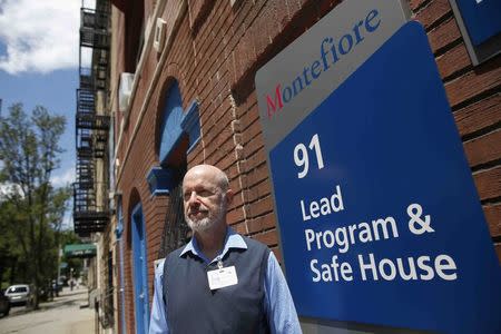Dr. Morri Markowitz, director of the lead poisoning clinic at Montefiore Children's Hospital in New York City, poses outside the "Lead Program & Safe House" in the Bronx borough of New York, U.S. on June 6, 2016. REUTERS/Shannon Stapleton