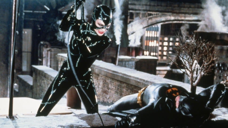 Michelle Pfeiffer as Catwoman using her whip against Michael Keaton as the Caped Crusader in 'Batman Returns.'