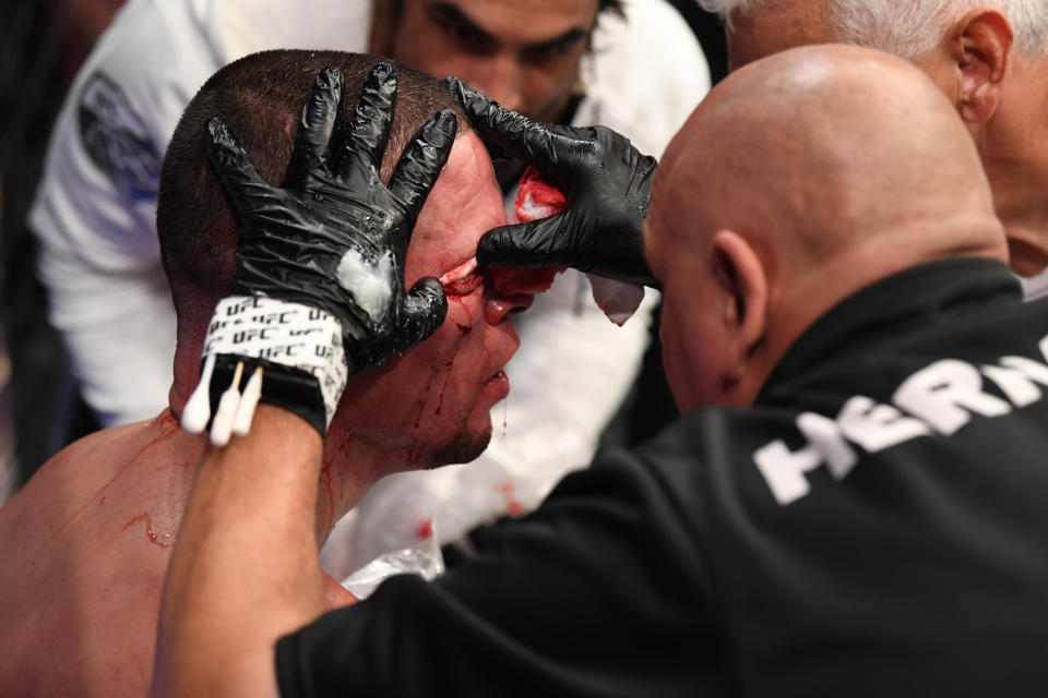 NEW YORK, NEW YORK - NOVEMBER 02: A cutman tends to the cut of Nate Diaz between rounds of his welterweight bout against Jorge Masvidal for the BMF title during the UFC 244 event at Madison Square Garden on November 02, 2019 in New York City. (Photo by Josh Hedges/Zuffa LLC via Getty Images)