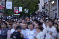 Real Madrid supporters start to arrive in Cibeles Square in Madrid to celebrate after their team clinched the La Liga title, Saturday, May 4, 2024. Real, who had won earlier in the day, clinched the title after Barcelona failed to beat Girona. (AP Photo/Manu Fernandez)
