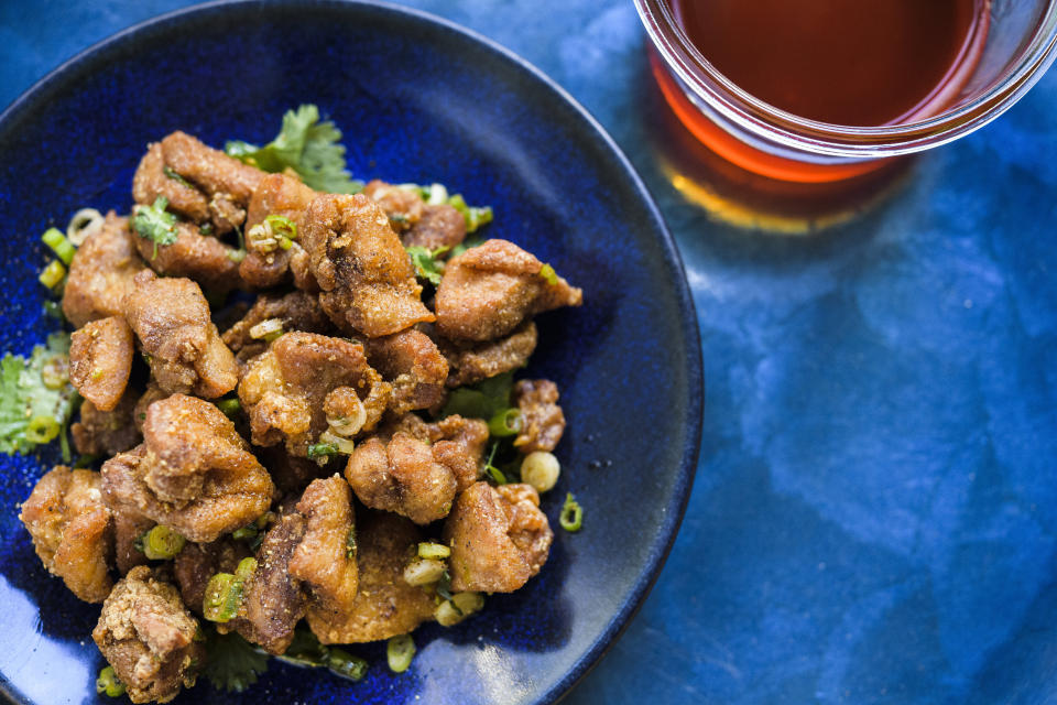 This image released by Milk Street shows a recipe for Crispy Sichuan-Chili Chicken. (Milk Street via AP)