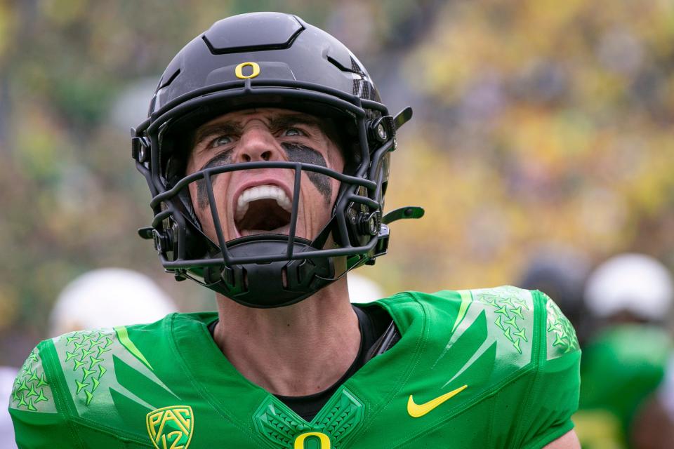 Oregon quarterback Bo Nix celebrates after running for a touchdown as the Oregon Ducks host Colorado in the Pac-12 opener Saturday, Sept. 23, 2023, at Autzen Stadium in Eugene, Ore.