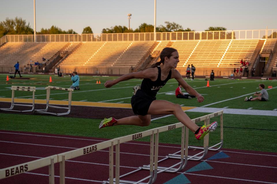 Jasper’s Madelyn Knies clears a hurdle in the 300 meter hurdles during the 2023 Southern Indiana Athletic Conference Girls Track & Field meet at Central High School in Evansville, Ind.,, Wednesday, May 3, 2023.