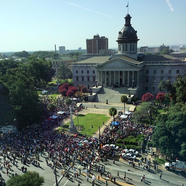 Crowds gather outside the South Carolina statehouse Friday, July 10 in Columbia, South Carolina awaiting the removal of the confederate flag. 