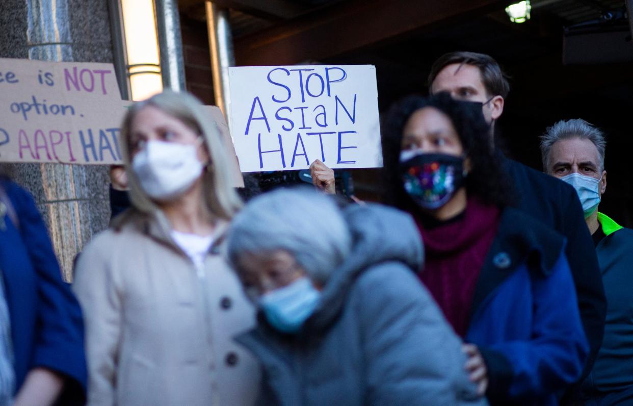 <p>File Image: People attend an Asian American anti-violence press conference outside the building were a 65-year-old Asian woman was attacked in New York on 30 March 2021</p> (AFP via Getty Images)