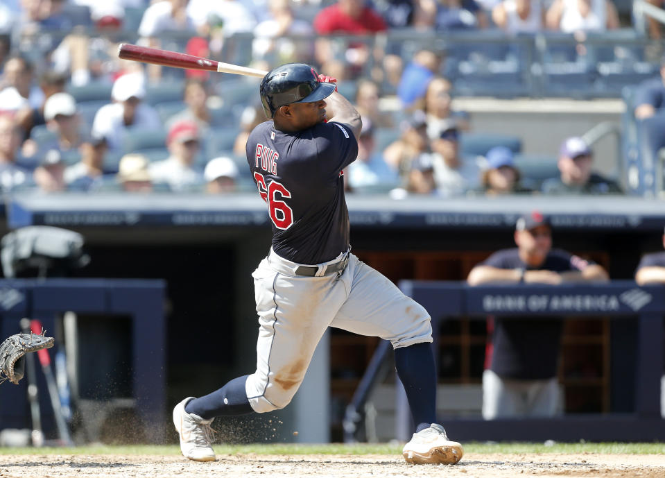 NEW YORK, NEW YORK - AUGUST 17:   Yasiel Puig #66 of the Cleveland Indians follows through on a fifth inning RBI single against the New York Yankees at Yankee Stadium on August 17, 2019 in New York City. (Photo by Jim McIsaac/Getty Images)