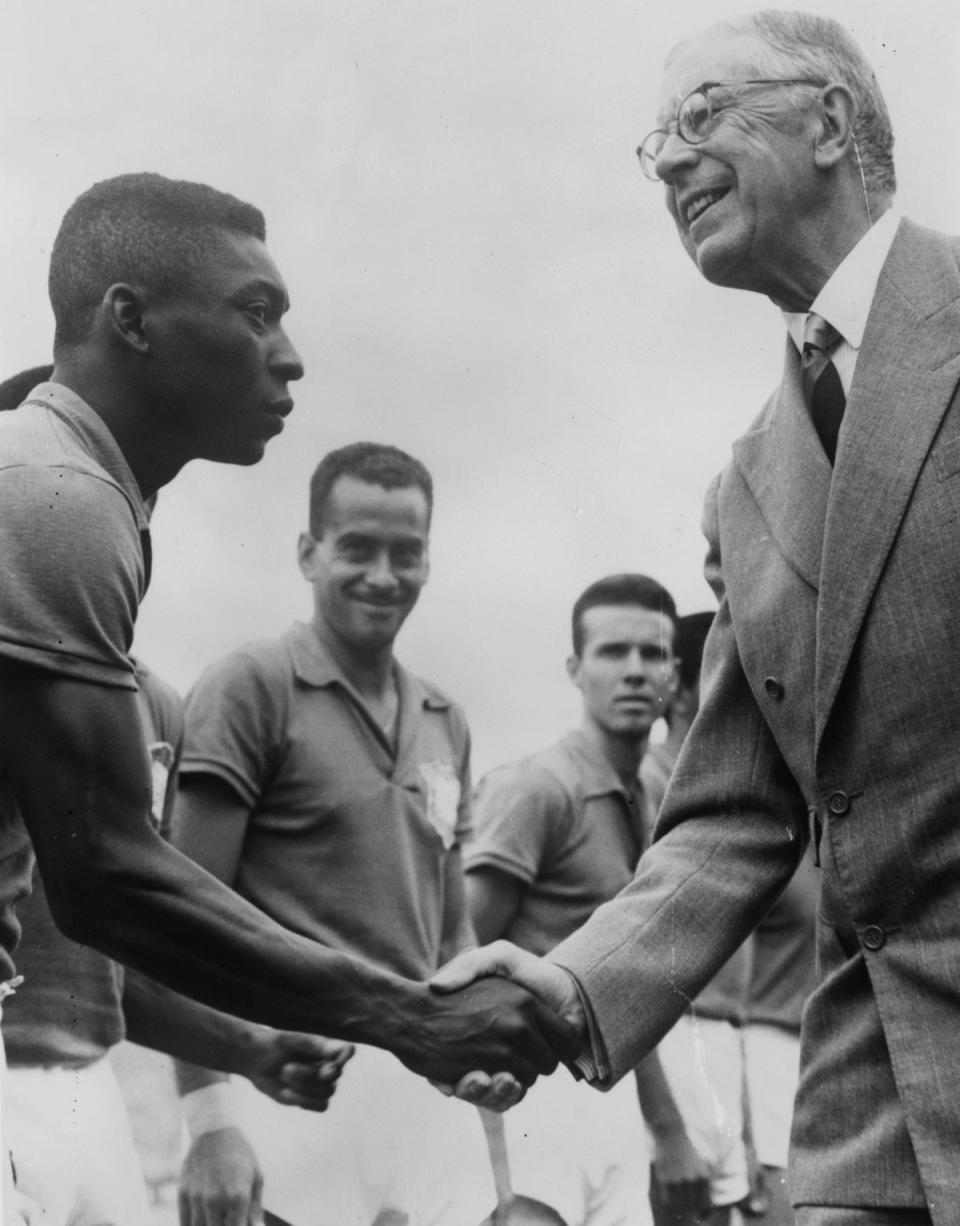 30th June 1958: Gustav VI Adolf, king of Sweden, (right) shakes hand with Pele before the final of the World Cup between Brazil and Sweden. (Getty Images)