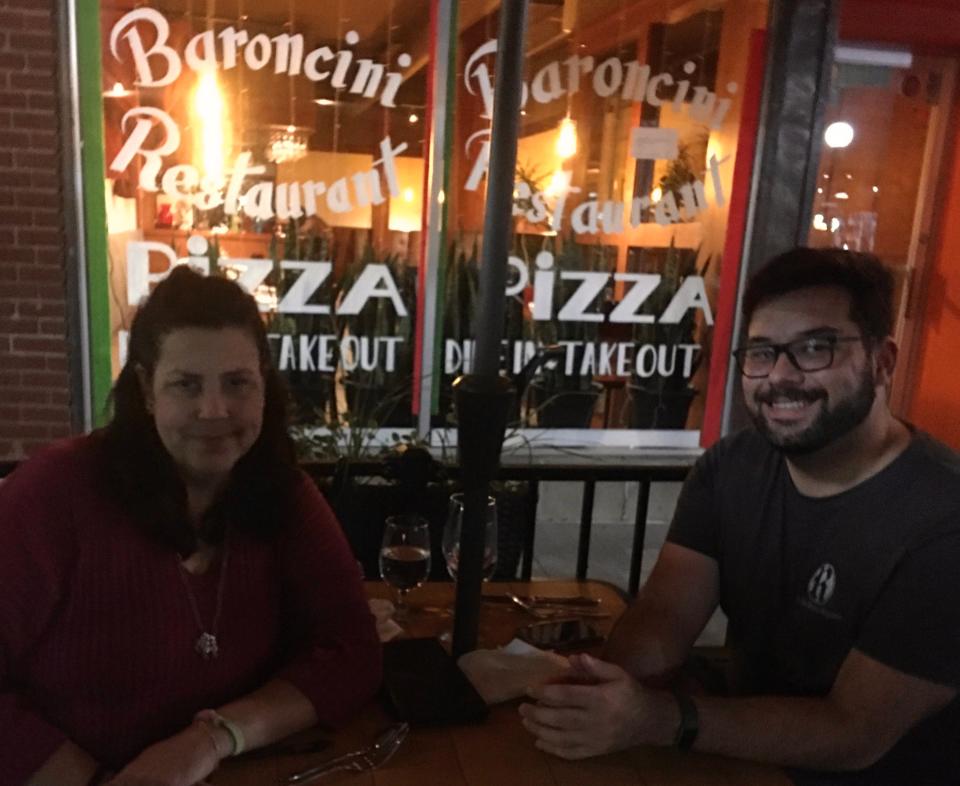 Press-Citizen reporter George Shillcock (right) and his mother Alicia Shillcock sit outside Baroncini Restaurant in Iowa City on Tuesday, September 6, 2022.