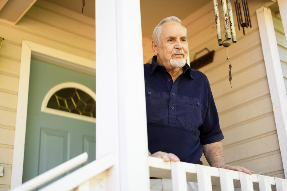 Carl Johnsen stands outside his Paradise, Calif., home, Thursday, Oct. 26, 2023. Facing a $14,702 quote to renew his homeowners insurance, Johnsen plans to let coverage lapse when it expires in November. (AP Photo/Noah Berger)