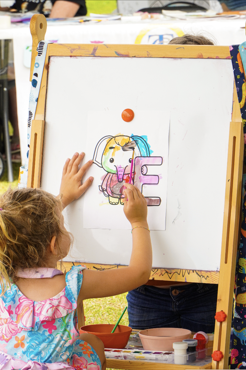 A child paints at Word of South on Saturday, April 22.
