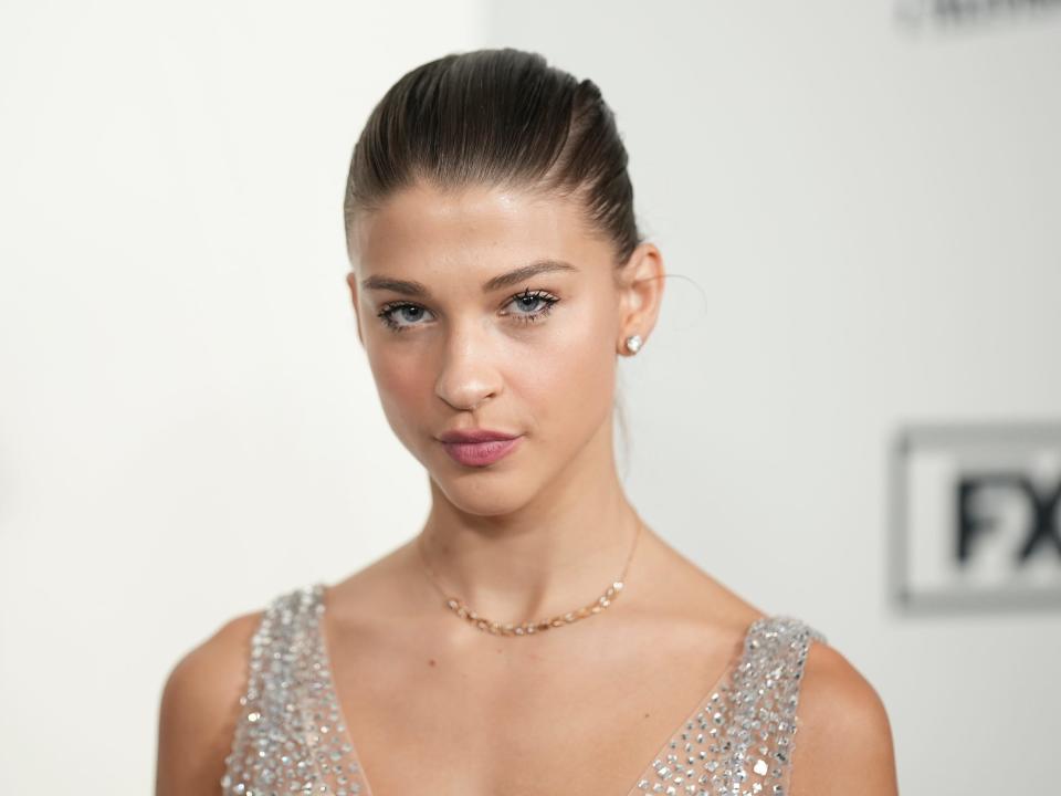 Phoebe Gates wears a sparkly gown to the red carpet for an event in January 2024.