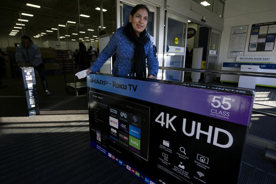 A shopper pushes a large TV out of a Best Buy on Black Friday in Aurora, Colorado on November 23, 2018. - Black Friday, the day after the US holiday of Thanksgiving, marks the beginning of the holiday shopping season with retailers offering significant savings through special one-day sales. (Photo by Jason Connolly / AFP)        (Photo credit should read JASON CONNOLLY/AFP via Getty Images)