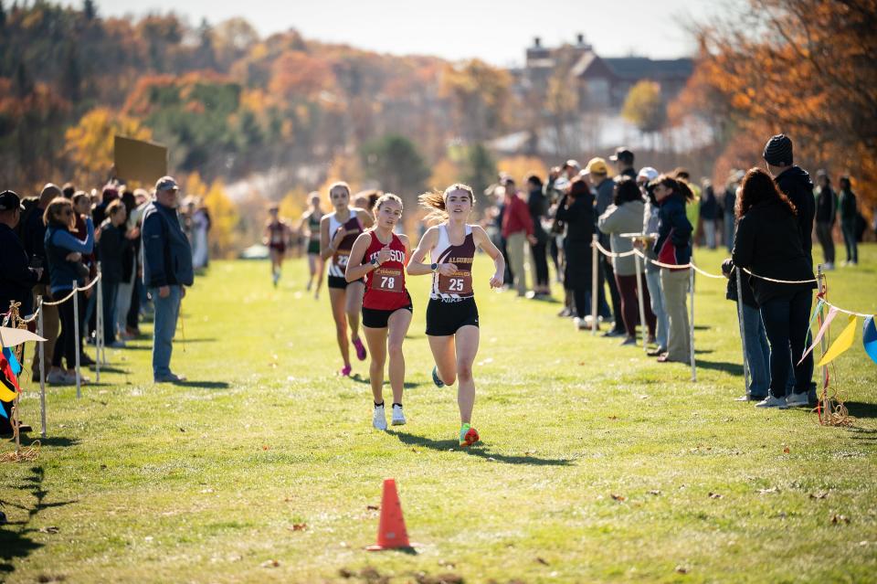 Algonquin's Brigid Purcell, right, uses a late finishing kick to pull ahead of Hudson's Rachel Korowski to take second in the Division 1 girls' race at the Central Mass. XC Championships at Gardner Municipal Golf Course.