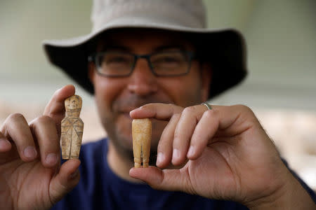 An archaeologist presents tools made of bone in the old city of Caesarea, Israel. April 26, 2017 REUTERS/Amir Cohen