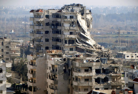 A general view shows damaged buildings in the northwestern Homs district of Al Waer, Syria, January 18, 2015. REUTERS/Stringer/File Photo