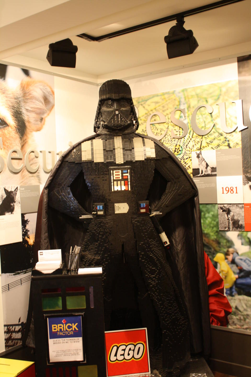 A LEGO Darth Vader is displayed near the master builder competition.