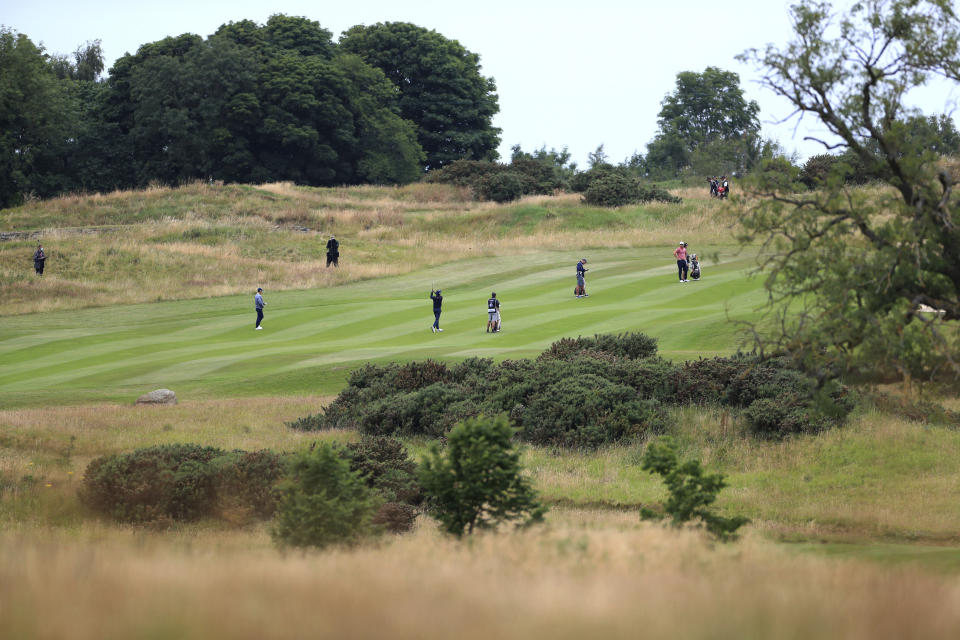 A general view of social distancing on the fairway during day one of the British Masters at Close House Golf Club, near Newcastle, England, Wednesday July 22, 2020. The European Tour resumes in earnest after its pandemic-induced shutdown with the British Masters starting Wednesday. (Mike Egerton/PA via AP)