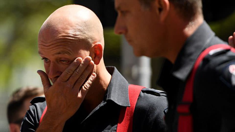 Devastated firefighters were among those in attendance at a memorial for those killed in the Bourke Street massacre. Source: AAP