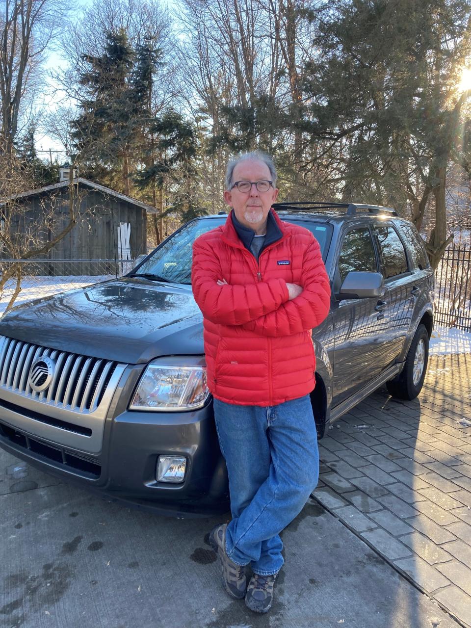 Tim Morse, seen here on Monday in his driveway in Port Huron, placed a reservation for the all-electric Ford F-150 Lightning in May 2021. He plans to convert that reservation to an order as soon as he receives an invitation to do so, he told the Free Press on Jan. 3, 2022.