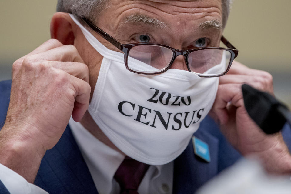 Census Bureau Director Steven Dillingham wears a mask with the words "2020 Census" as he arrives to testify before a House Committee on Oversight and Reform hearing on the 2020 Census​ on Capitol Hill, Wednesday, July 29, 2020, in Washington. (AP Photo/Andrew Harnik)