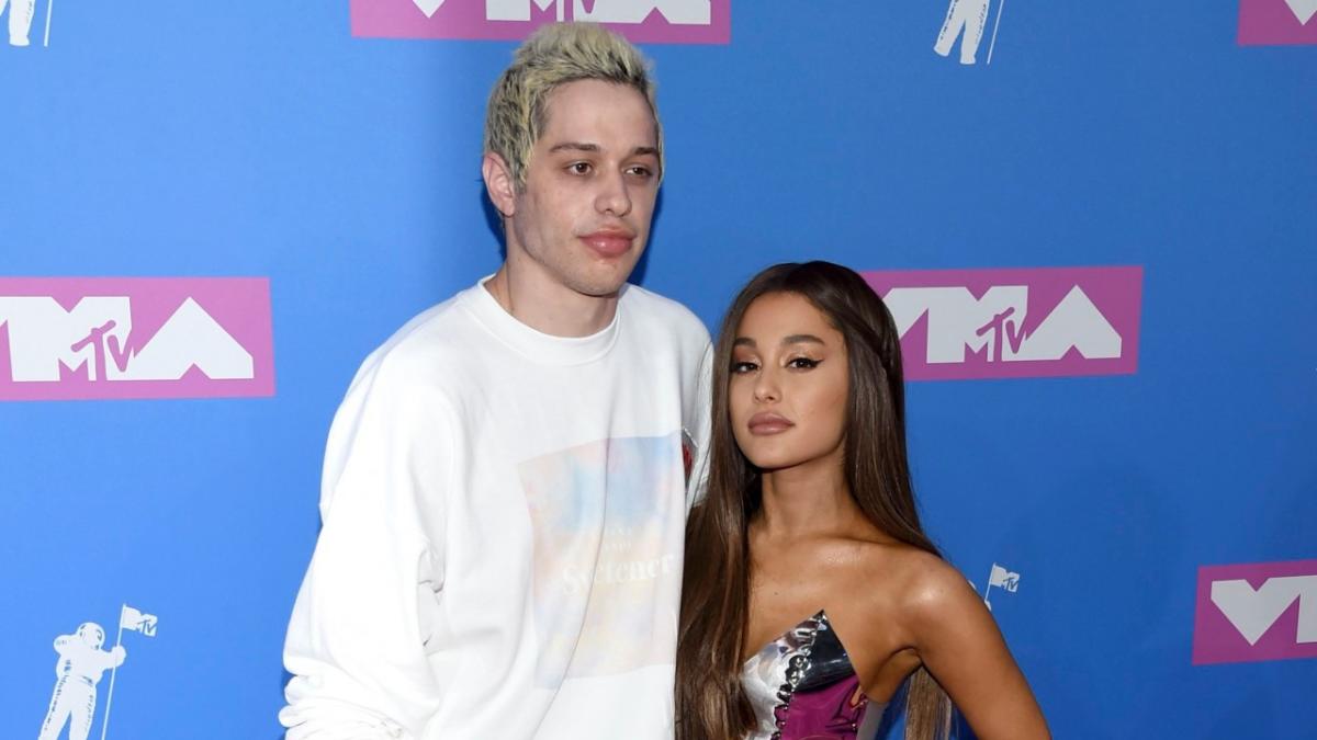 Ariana Grande greets fans while attending her brother Frankie