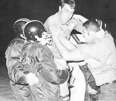 Rio Mesa coach John Reardon is carried off the field after leading the Spartans to their lone CIF-Southern Section football championship in 1971. Rio Mesa beat Paso Robles 28-20 to win the Class A title.