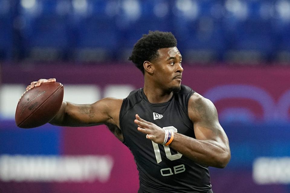 FILE - Liberty quarterback Malik Willis runs a drill during the NFL football scouting combine, Thursday, March 3, 2022, in Indianapolis. Franchises still searching for a prized quarterback won't find much star power in this year's crop of college QBs. Still, there's potential upgrades to be had in the likes of Temple's Malik Willis and Pitt's Kenny Pickett. (AP Photo/Darron Cummings, File)