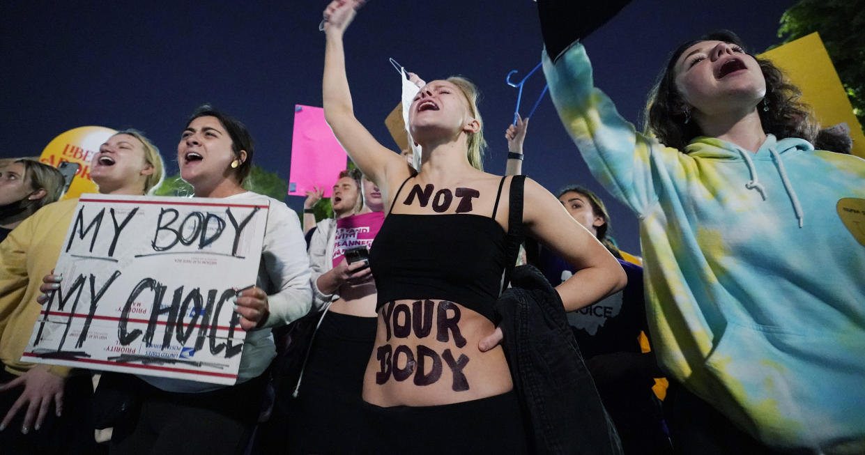 A crowd of people gather outside the Supreme Court, May 3, 2022 in Washington after a draft opinion circulated among Supreme Court justices confirmed that a majority of them supported overturning the 1973 case Roe v. Wade that legalized abortion nationwide. (Alex Brandon / AP)