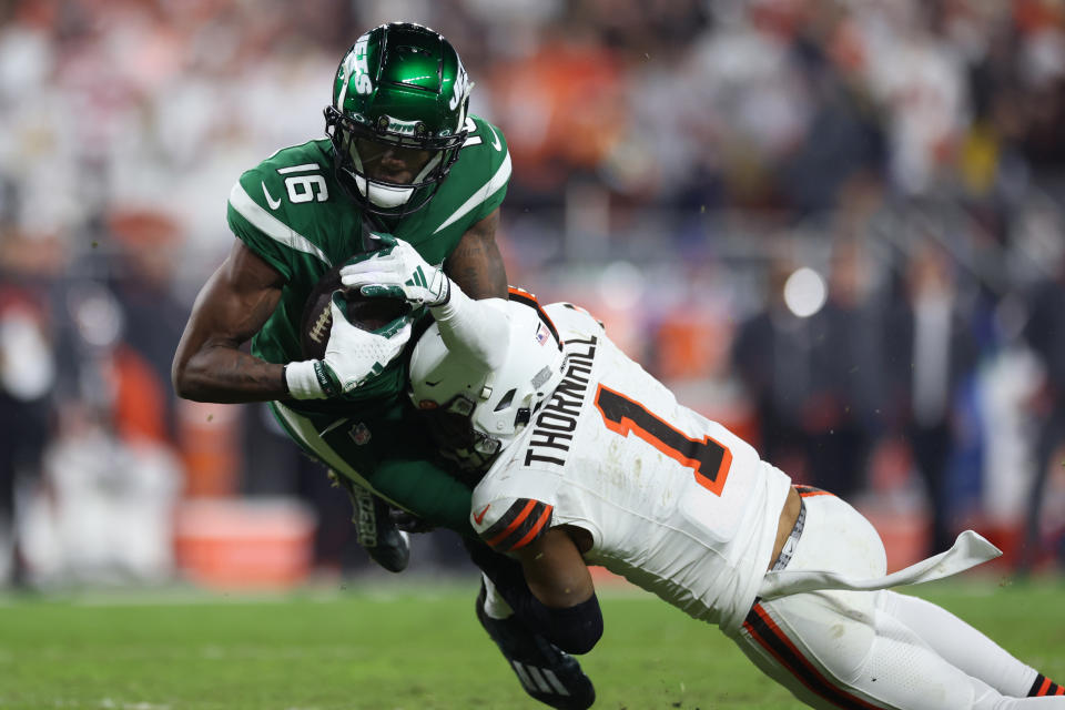 Dec 28, 2023; Cleveland, Ohio, USA; New York Jets wide receiver Jason Brownlee (16) is tackled by Cleveland Browns safety <a class="link " href="https://sports.yahoo.com/nfl/players/31895" data-i13n="sec:content-canvas;subsec:anchor_text;elm:context_link" data-ylk="slk:Juan Thornhill;sec:content-canvas;subsec:anchor_text;elm:context_link;itc:0">Juan Thornhill</a> (1) during the second half at Cleveland Browns Stadium. Mandatory Credit: Scott Galvin-USA TODAY Sports