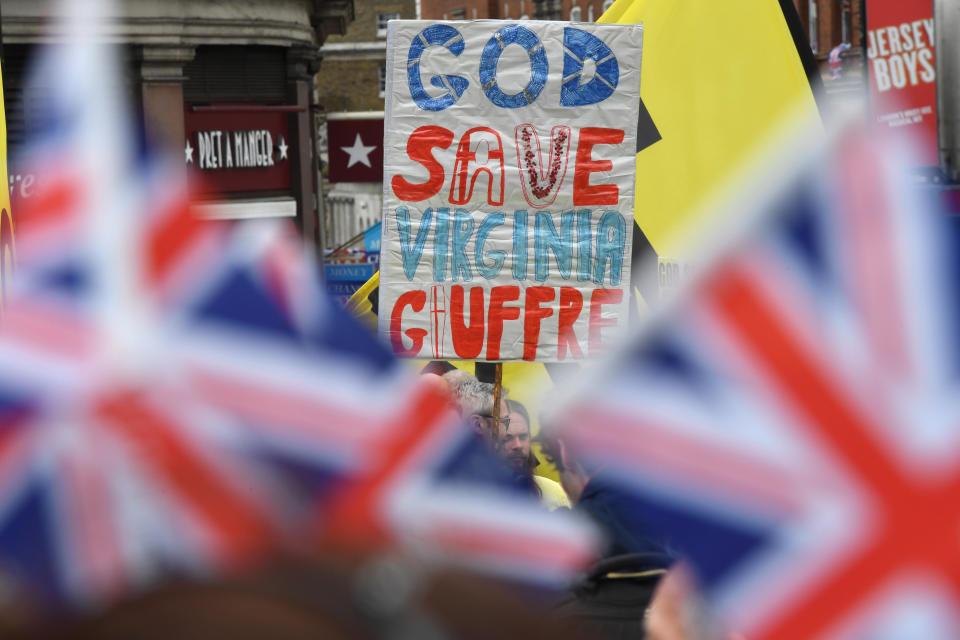 LONDON, ENGLAND - MAY 06: A protester holds a placard ahead of the Coronation of King Charles III and Queen Camilla on May 06, 2023 in London, England. The Coronation of Charles III and his wife, Camilla, as King and Queen of the United Kingdom of Great Britain and Northern Ireland, and the other Commonwealth realms takes place at Westminster Abbey today. Charles acceded to the throne on 8 September 2022, upon the death of his mother, Elizabeth II. (Photo by Chris J Ratcliffe/Getty Images)