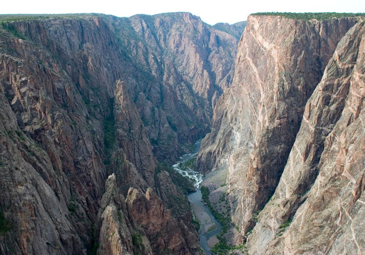 Painted Wall is seen on the right looking downstream from Chasm View at Black Canyon of the Gunnison National Park.