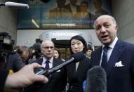 French Foreign Affairs Minister Laurent Fabius (R), Interior minister Bernard Cazeneuve and Culture Minister Fleur Pellerin are surrounded by media as they leave French television network TV5Monde headquarters in Paris, April 9, 2015. REUTERS/Benoit Tessier