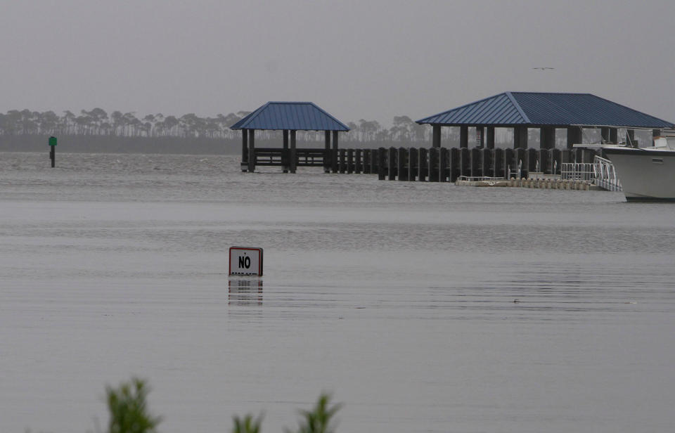 <p>The No Wake sign is almost submerged at the flooded Ocean Springs Harbor on Wednesday, June 21, 2017. Since Tuesday evening, Tropical Storm Cindy has dumped a deluge of rain on the Mississippi Gulf Coast. (Photo: Tim Isbell/Biloxi Sun Herald/TNS via Getty Images) </p>