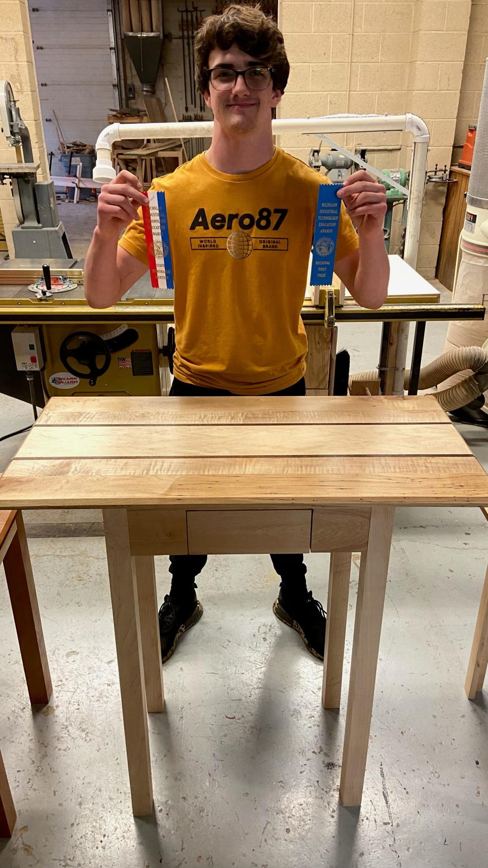 Student Lukas Selph took first place in the regional woodshop competition with his table.