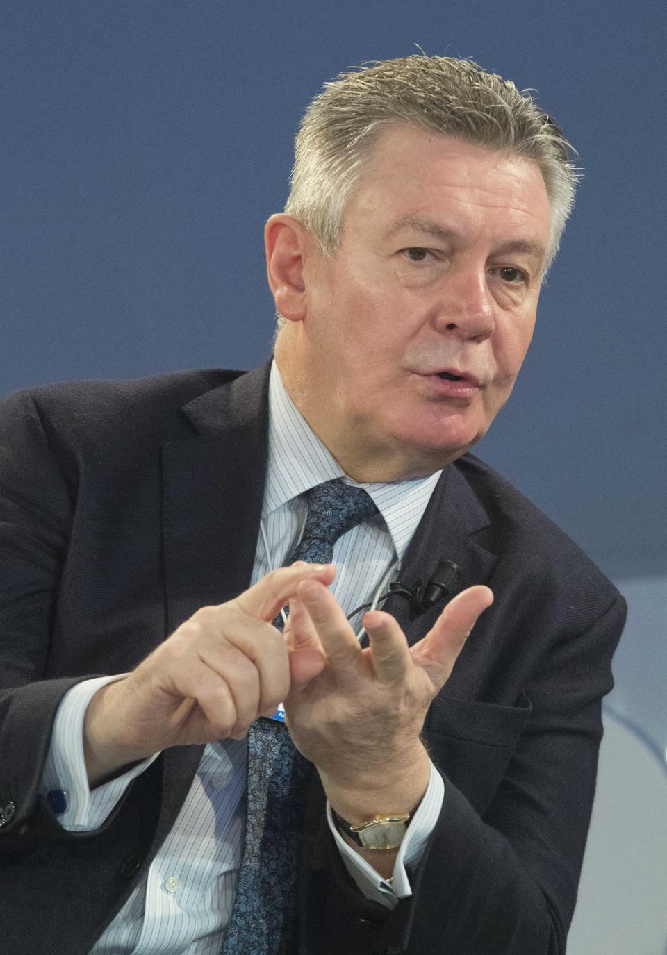 EU Trade Commissioner Karel De Gucht, gestures as he speaks with U.S. Trade Representative Michael Froman prior to a session at the World Economic Forum in Davos, Switzerland, Saturday, Jan. 25, 2014. Global leaders argued Friday that efforts to eradicate poverty must be linked to climate change, saying that rising temperatures will have widespread effects on everything from food supplies to education. (AP Photo/Michel Euler)