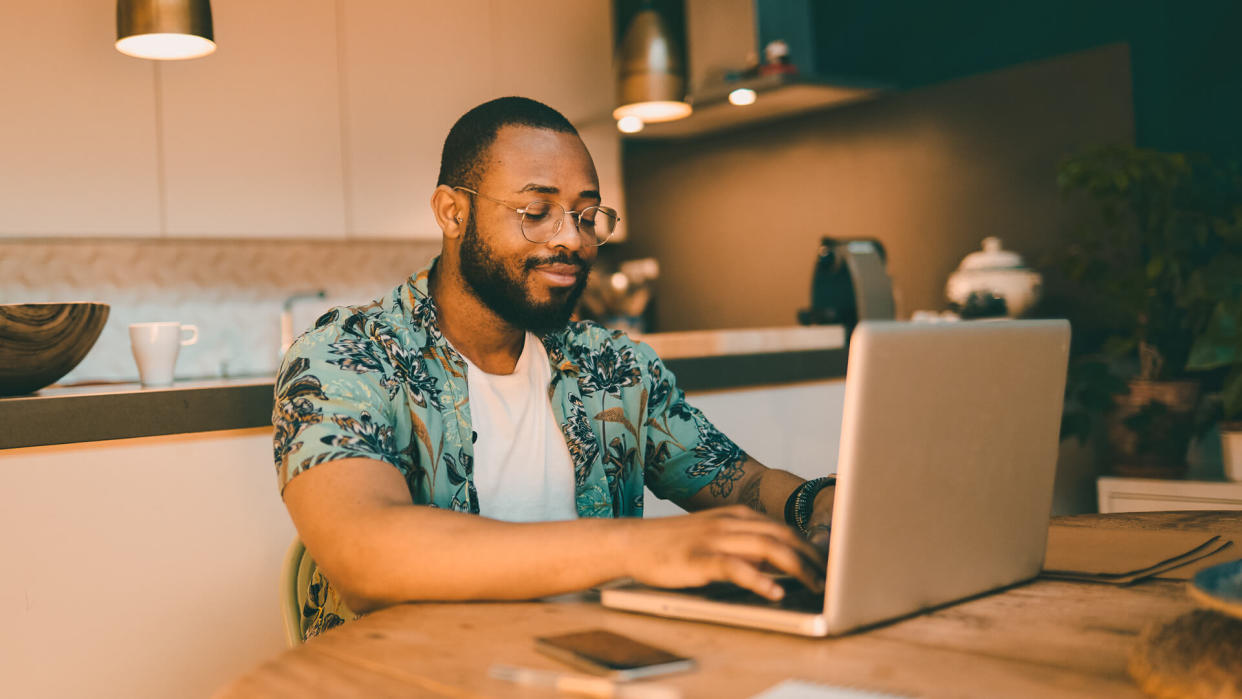 Young millennial using technology for his investment and on line banking.