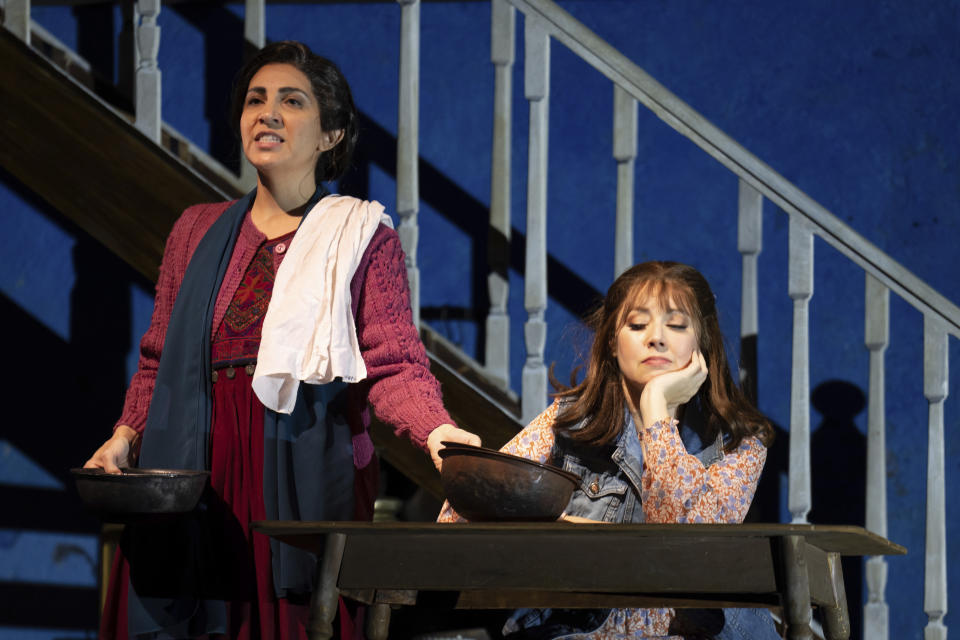 Karin Mushegain, left, who portrays Mariam, and Maureen McKay, who portrays Laila, perform in a dress rehearsal for the opera "A Thousand Splendid Suns," in Seattle, on Wednesday, Feb. 22, 2023. (AP Photo/Stephen Brashear)